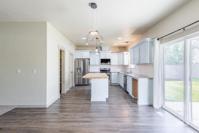11965 Goldfinch St, Caldwell, ID 83605 - kitchen with appliances with stainless steel finishes, a sink, plenty of natural light, and butcher block counters
