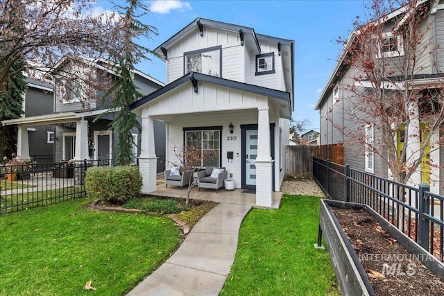 2315 N 22nd St, Boise, ID 83702 - view of front facade featuring fence, board and batten siding, a porch, and a front yard