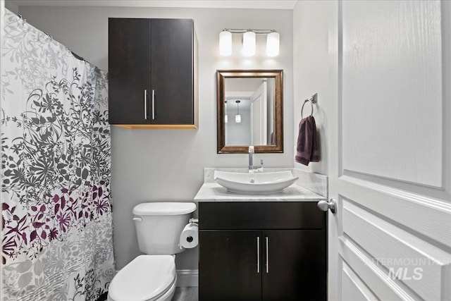 2315 N 22nd St, Boise, ID 83702 - bathroom featuring toilet, curtained shower, and vanity
