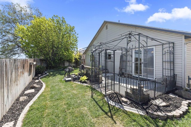 view of yard with a fenced backyard and a patio area
