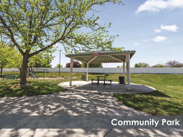 view of home's community featuring a gazebo, fence, and a yard