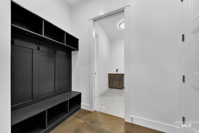 mudroom featuring sink and dark hardwood / wood-style floors