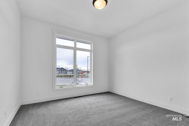 empty room with carpet flooring