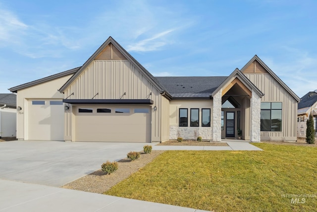 modern inspired farmhouse featuring a garage and a front yard