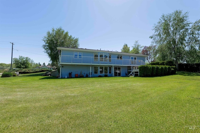 back of house with a yard