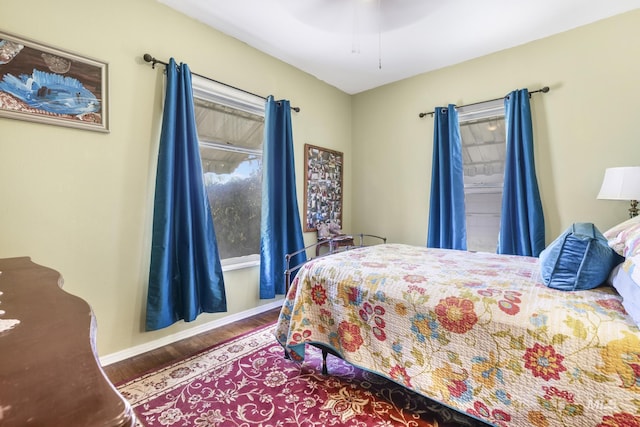 411 E 6th Ave, Twin Falls, ID 83301 - bedroom featuring wood finished floors, baseboards, and ceiling fan