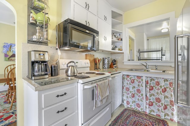 411 E 6th Ave, Twin Falls, ID 83301 - kitchen featuring black microwave, white range with electric cooktop, a sink, open shelves, and light countertops