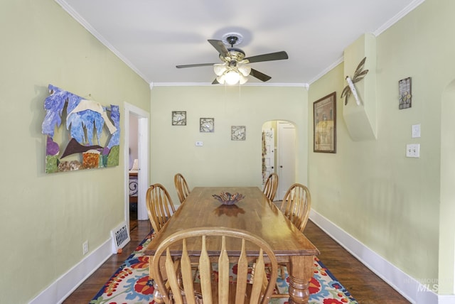 411 E 6th Ave, Twin Falls, ID 83301 - dining area with arched walkways, ceiling fan, wood finished floors, and crown molding