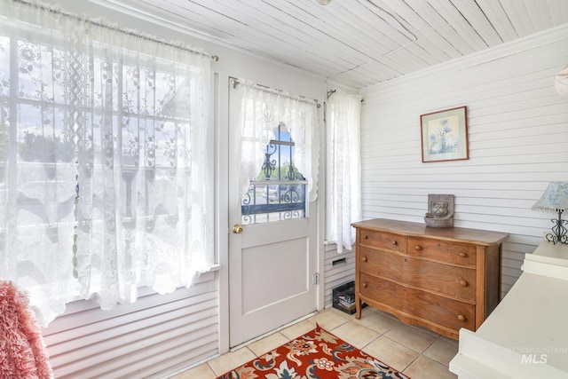 411 E 6th Ave, Twin Falls, ID 83301 - entryway with light tile patterned flooring and wooden walls