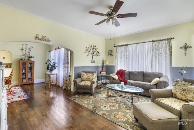 411 E 6th Ave, Twin Falls, ID 83301 - living room featuring ceiling fan, arched walkways, wood finished floors, and ornamental molding