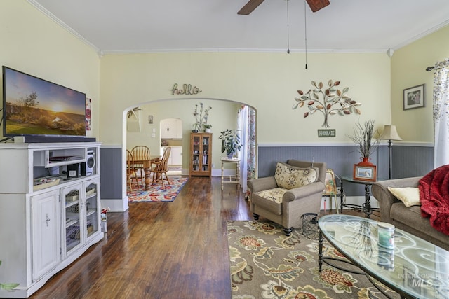 411 E 6th Ave, Twin Falls, ID 83301 - living area featuring arched walkways, wood finished floors, crown molding, a ceiling fan, and wainscoting