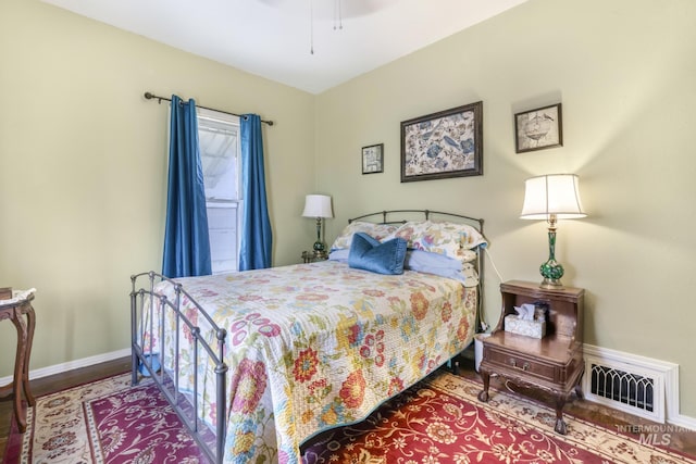 411 E 6th Ave, Twin Falls, ID 83301 - bedroom with wood finished floors, baseboards, and ceiling fan