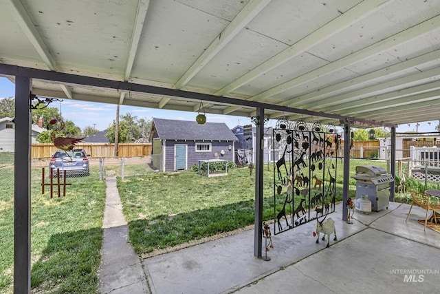 411 E 6th Ave, Twin Falls, ID 83301 - view of patio / terrace featuring area for grilling, an outbuilding, and a storage shed