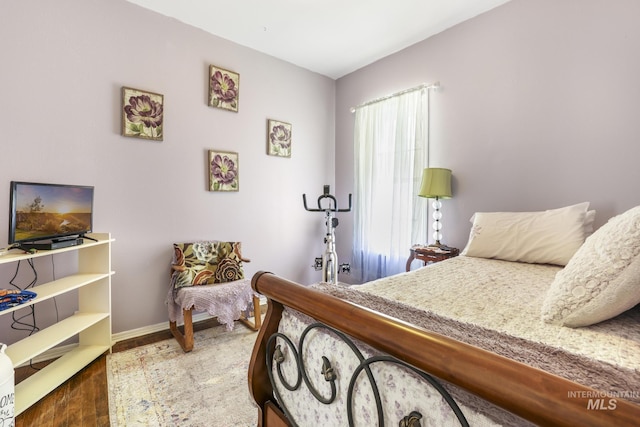 411 E 6th Ave, Twin Falls, ID 83301 - bedroom with wood finished floors and baseboards