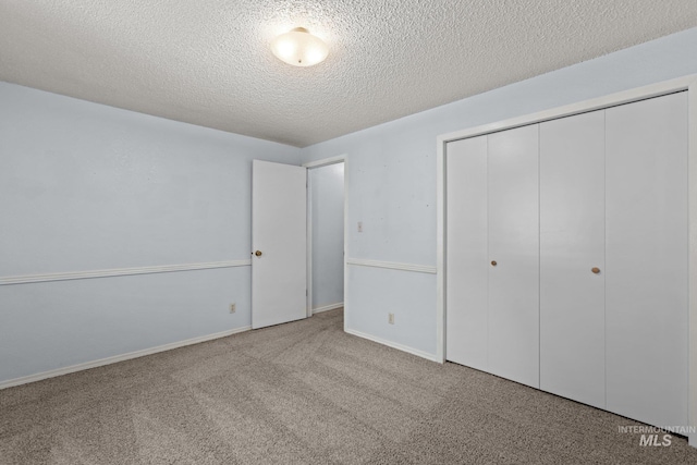 7171 Bluebird, Boise, ID 83703 - unfurnished bedroom with carpet, a closet, and a textured ceiling
