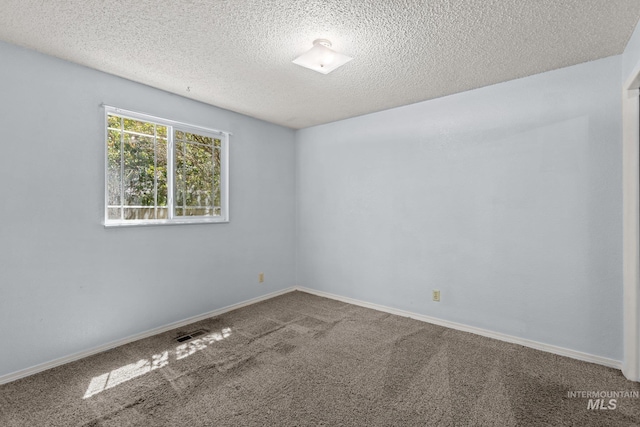 7171 Bluebird, Boise, ID 83703 - empty room with a textured ceiling and carpet flooring