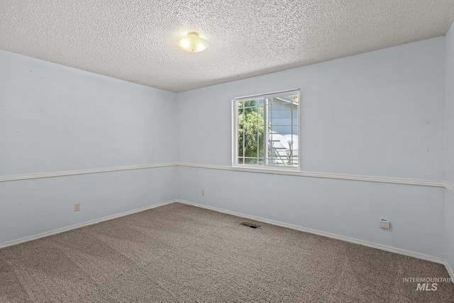 7171 Bluebird, Boise, ID 83703 - carpeted empty room featuring a textured ceiling and baseboards