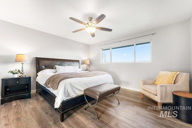 bedroom featuring ceiling fan and hardwood / wood-style floors