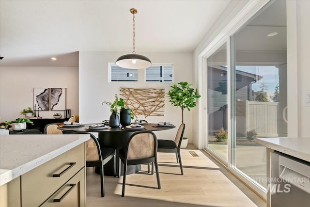 dining room with light hardwood / wood-style flooring