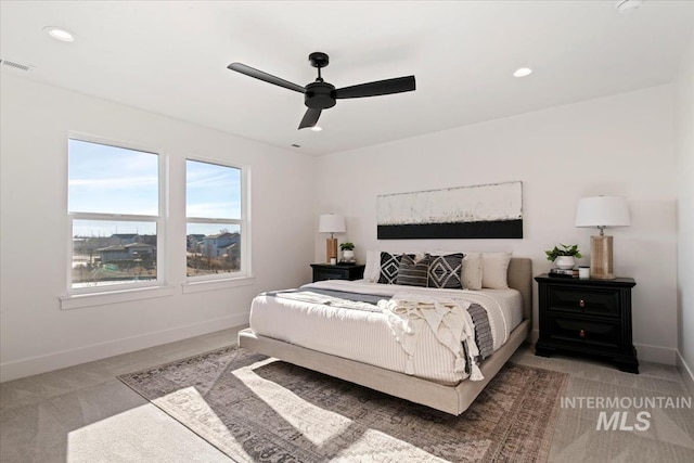 bedroom with light carpet and ceiling fan