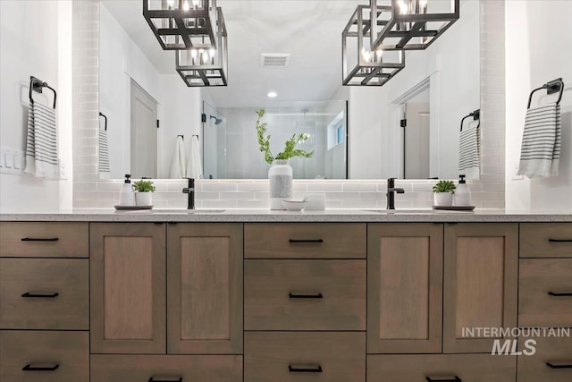 bathroom featuring walk in shower, vanity, and backsplash