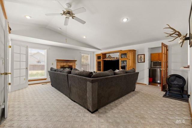 4667 S Shawnee Way, Boise, ID 83709 - living room featuring vaulted ceiling, light colored carpet, a ceiling fan, recessed lighting, and a tile fireplace