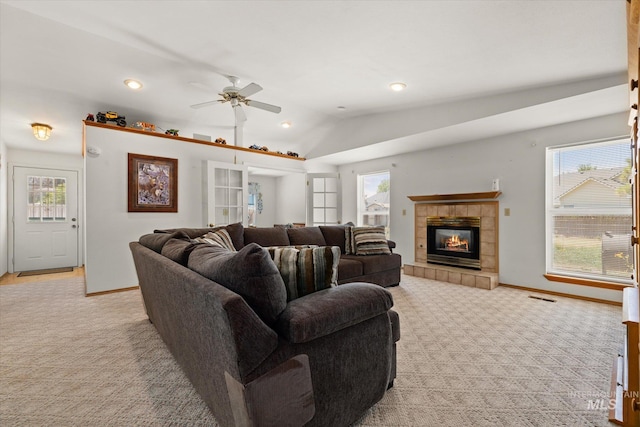 4667 S Shawnee Way, Boise, ID 83709 - living room with light colored carpet, a ceiling fan, lofted ceiling, a tile fireplace, and recessed lighting
