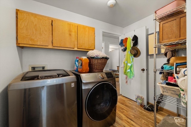 4667 S Shawnee Way, Boise, ID 83709 - washroom with cabinet space, separate washer and dryer, and light wood-type flooring