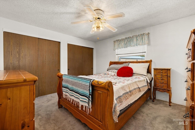 4667 S Shawnee Way, Boise, ID 83709 - bedroom with carpet, multiple closets, a textured ceiling, and ceiling fan