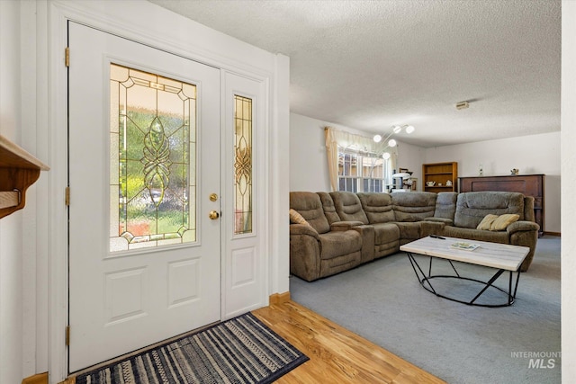 4667 S Shawnee Way, Boise, ID 83709 - foyer with a textured ceiling and wood finished floors
