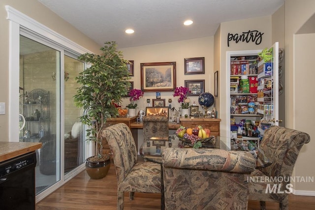 living area featuring wood finished floors and recessed lighting