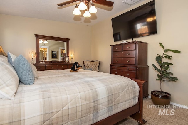 bedroom featuring carpet, baseboards, and ceiling fan