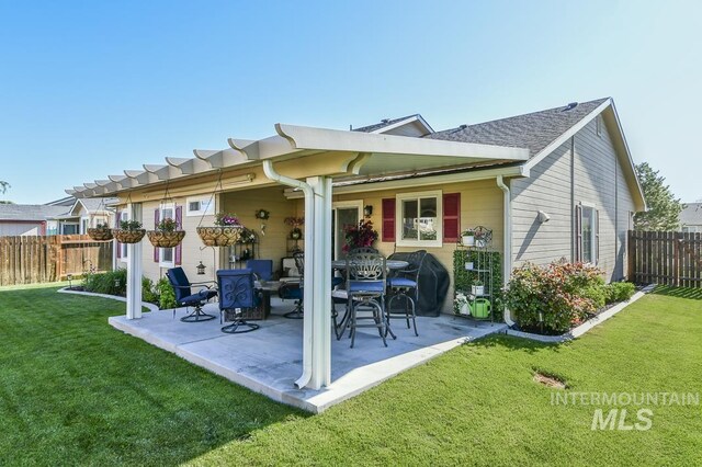 rear view of property featuring a patio area