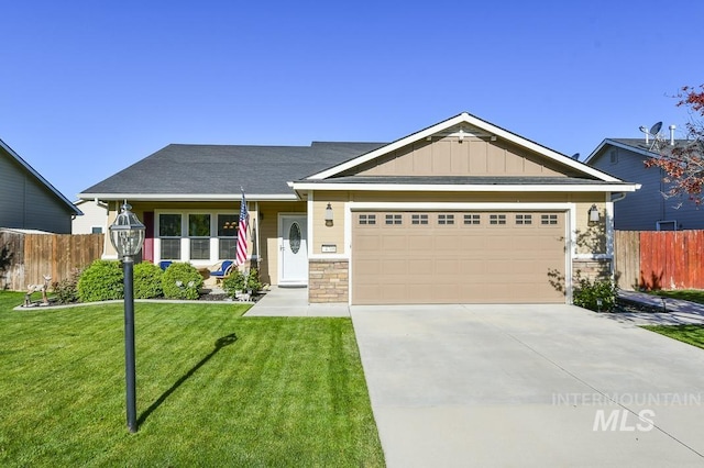 view of front of property featuring an attached garage, driveway, board and batten siding, and stone siding