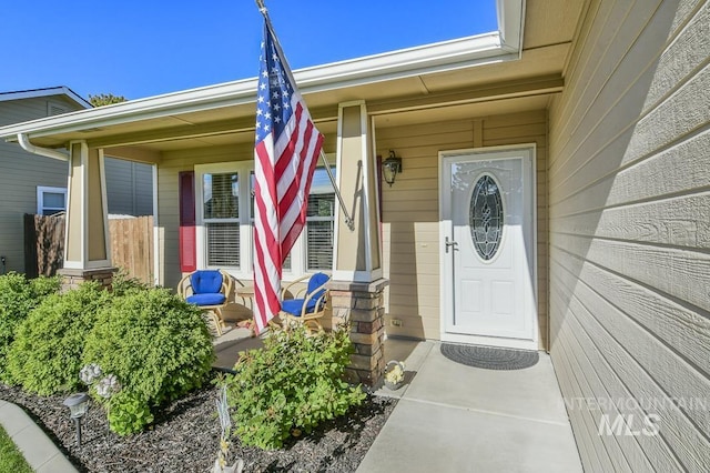 doorway to property featuring a porch