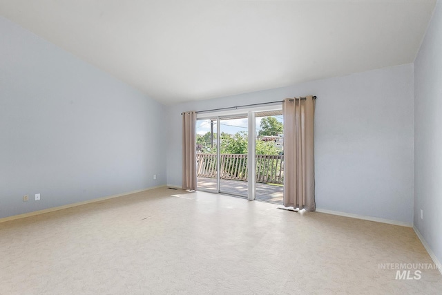 1015 24th St, Lewiston, ID 83501 - carpeted empty room with baseboards and vaulted ceiling