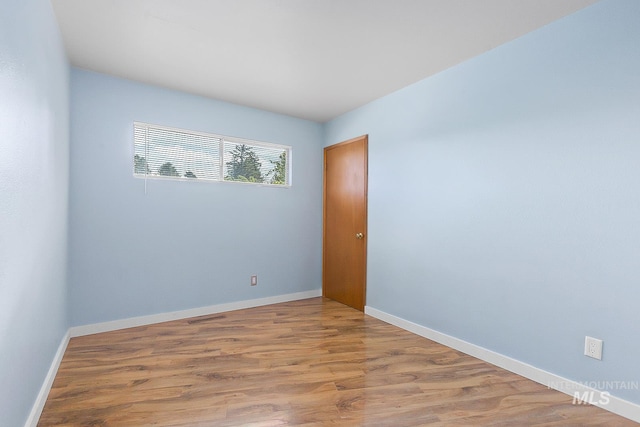 1015 24th St, Lewiston, ID 83501 - spare room featuring wood finished floors and baseboards