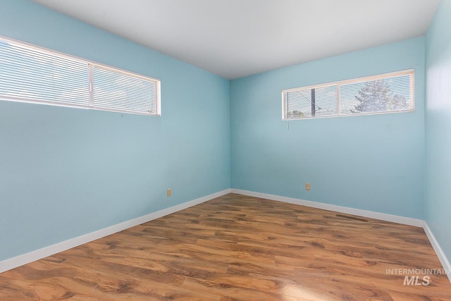 1015 24th St, Lewiston, ID 83501 - spare room featuring wood finished floors and baseboards