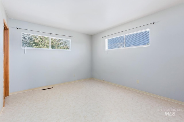 1015 24th St, Lewiston, ID 83501 - carpeted empty room featuring healthy amount of natural light and baseboards