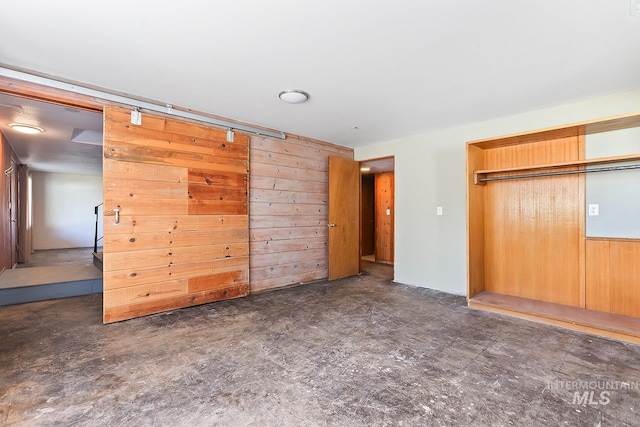 1015 24th St, Lewiston, ID 83501 - unfurnished bedroom featuring wood walls and a closet