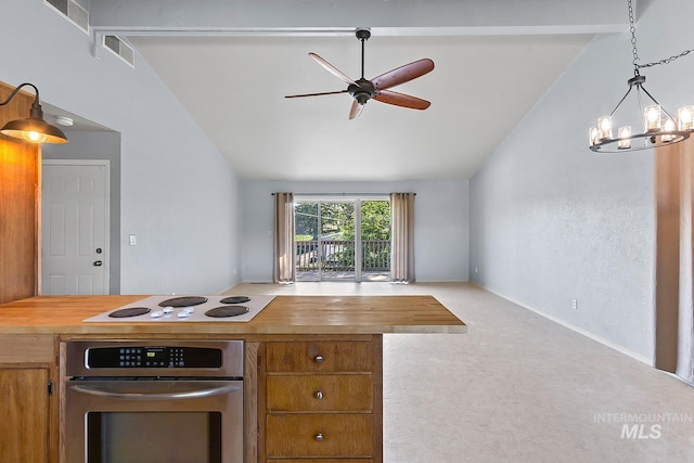 1015 24th St, Lewiston, ID 83501 - kitchen featuring oven, lofted ceiling, a ceiling fan, carpet flooring, and white electric cooktop