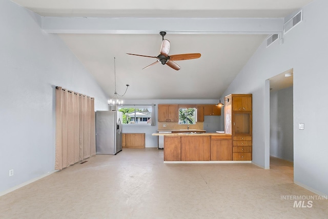 1015 24th St, Lewiston, ID 83501 - kitchen featuring stainless steel fridge with ice dispenser, beam ceiling, a peninsula, a ceiling fan, and brown cabinetry
