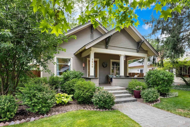 1220 N 21st St, Boise, ID 83702 - view of front of home featuring a porch and a front lawn