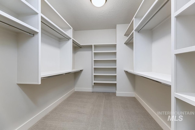 3389 E Englehart Dr, Meridian, ID 83642 - walk in closet featuring carpet floors and built in desk