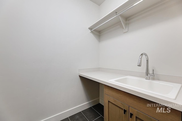 3389 E Englehart Dr, Meridian, ID 83642 - washroom featuring a sink and dark tile patterned flooring