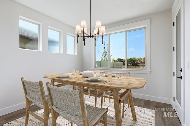 3389 E Englehart Dr, Meridian, ID 83642 - dining room with a chandelier and dark wood-style floors