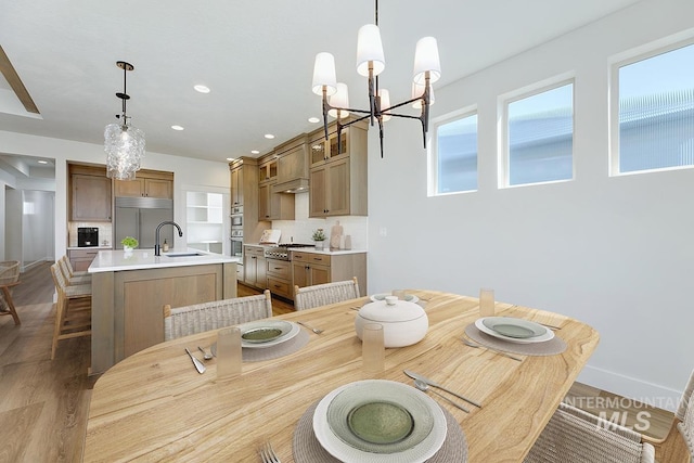 3389 E Englehart Dr, Meridian, ID 83642 - dining room featuring a chandelier, recessed lighting, and wood finished floors