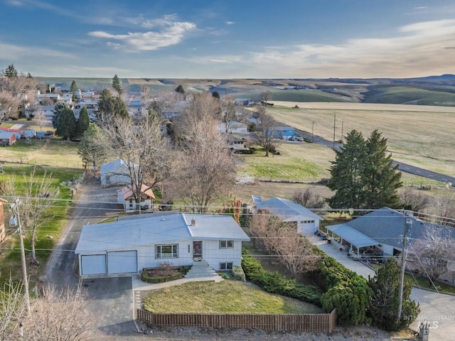 birds eye view of property with a rural view