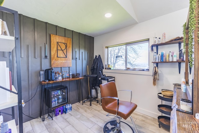 interior space featuring recessed lighting, a dry bar, baseboards, and wood finish floors