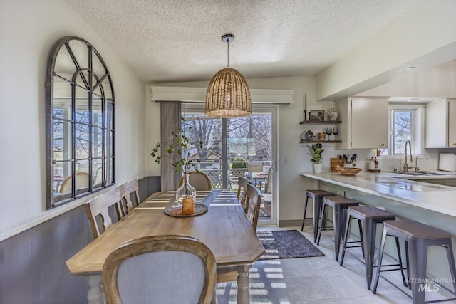 dining room featuring a textured ceiling